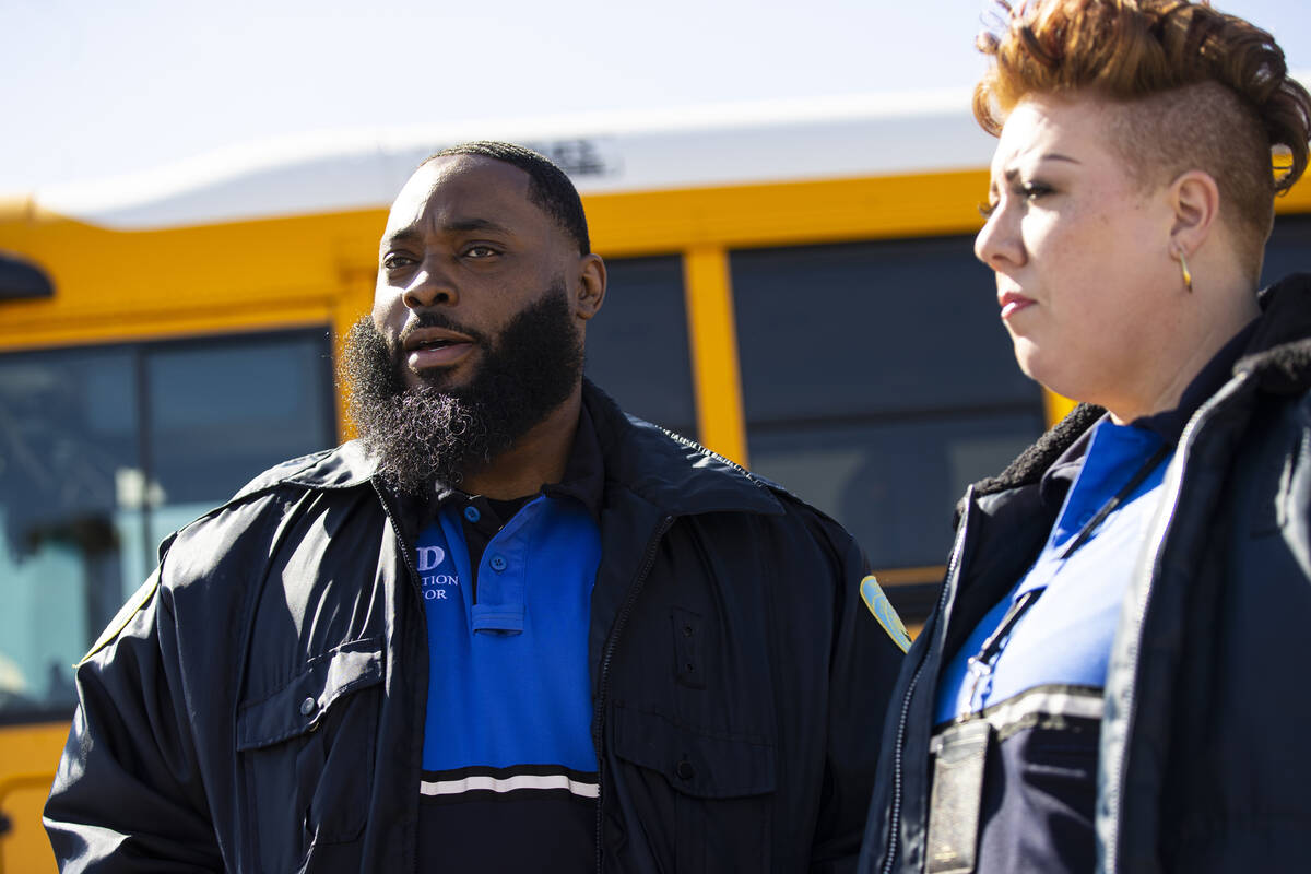 Clark County School District transportation investigators Lawrence Turner, left, and Carisa Hin ...