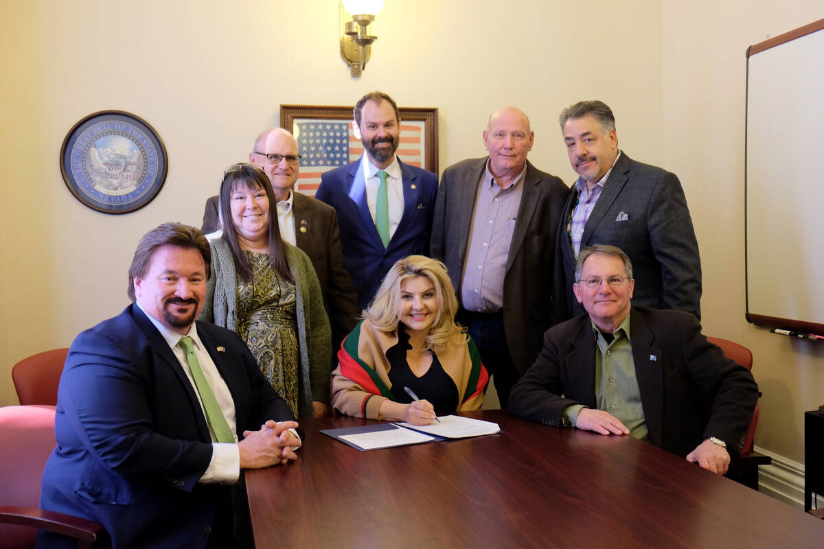 Las Vegas City Councilwoman Michele Fiore, center, poses with Republican party officials after ...