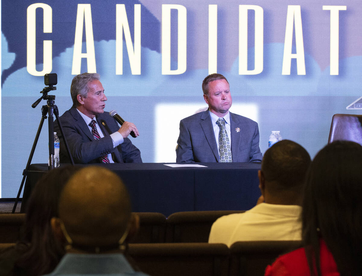 The Clark County Sheriff candidate Stan Hyt, left, speaks as former Undersheriff and candidate ...