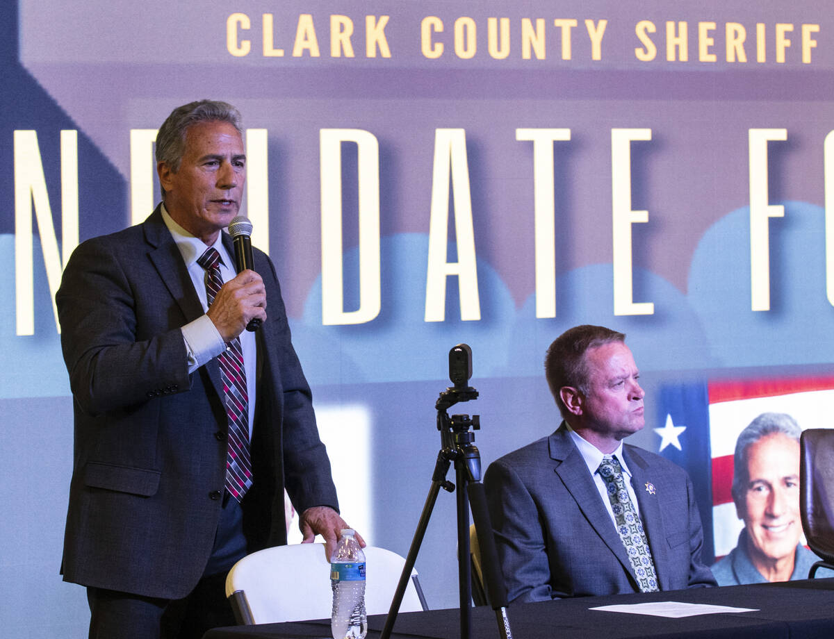 The Clark County Sheriff candidate Stan Hyt, left, speaks as former Undersheriff Kevin and cand ...