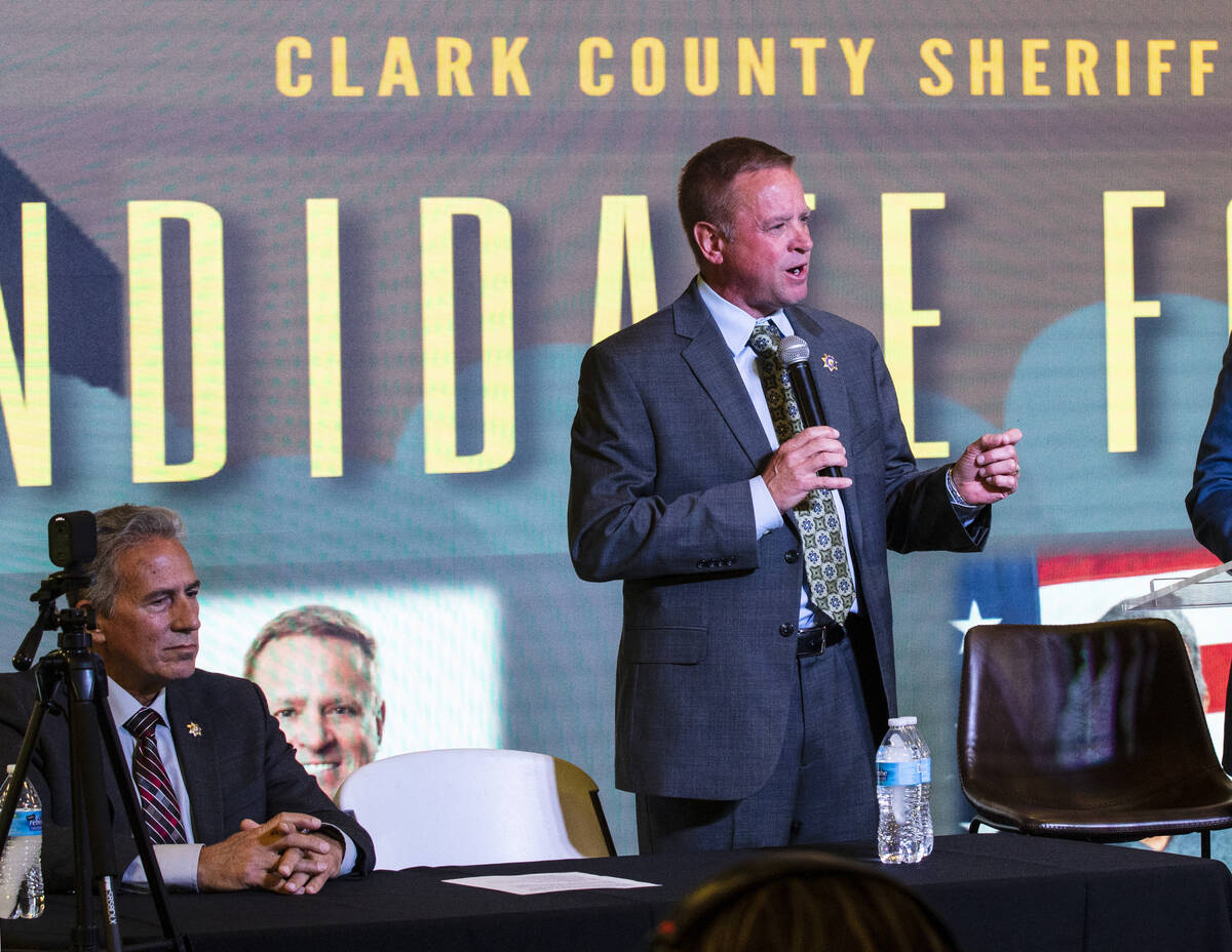 Former Undersheriff and the Clark County Sheriff candidate Kevin McMahill, center, speaks as ca ...