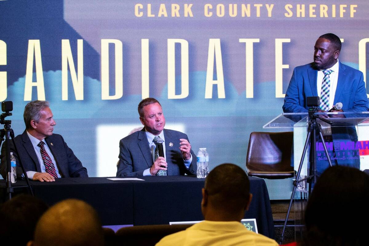 Former Undersheriff and the Clark County Sheriff candidate Kevin McMahill, center, speaks as ca ...