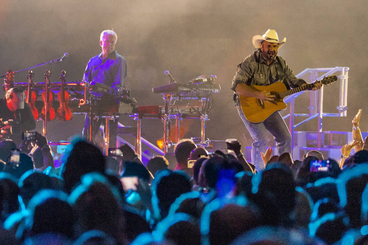 Garth Brooks performs before the crowd at Allegiant Stadium on Friday, July 10 2021, in Las Veg ...