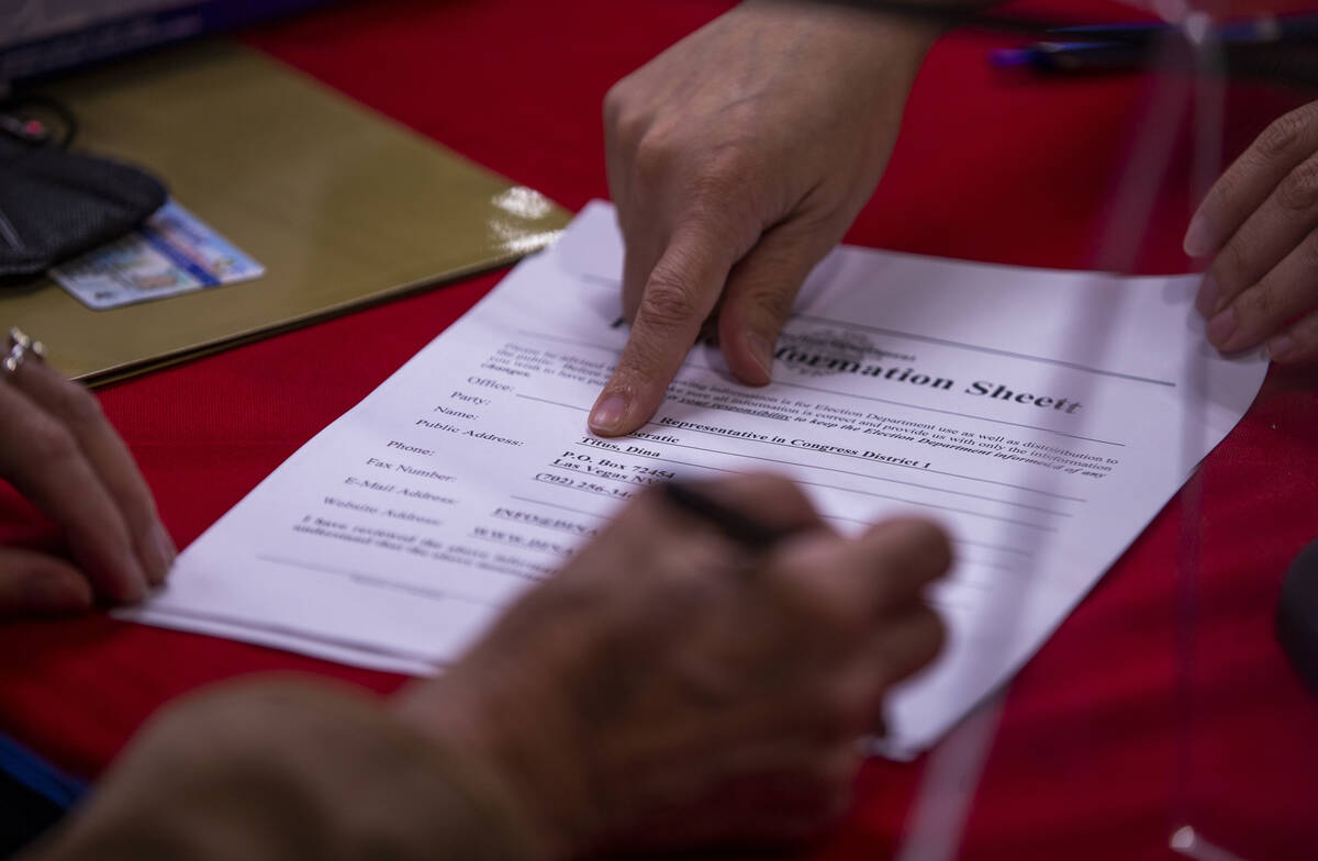 Rep. Dina Titus, D-Nev., signs paperwork as she files for re-election at the Clark County Gover ...