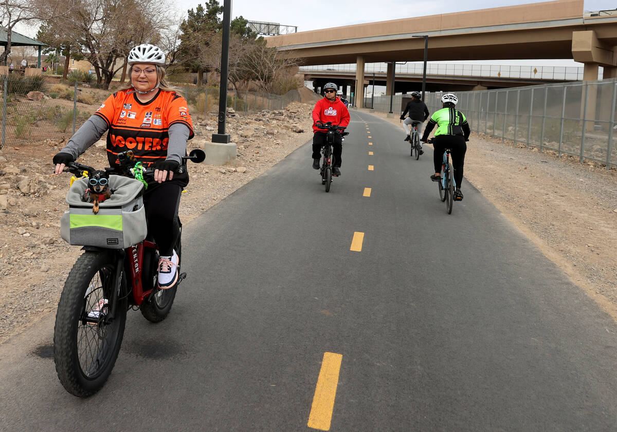 Lisa Magaro and her dog Venus ride their bike during the opening of The Harry Reid Union Pacifi ...