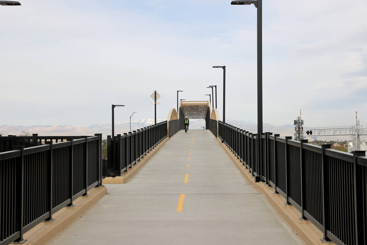 A cyclist rides their bike during the opening of The Harry Reid Union Pacific Railroad Trail ex ...