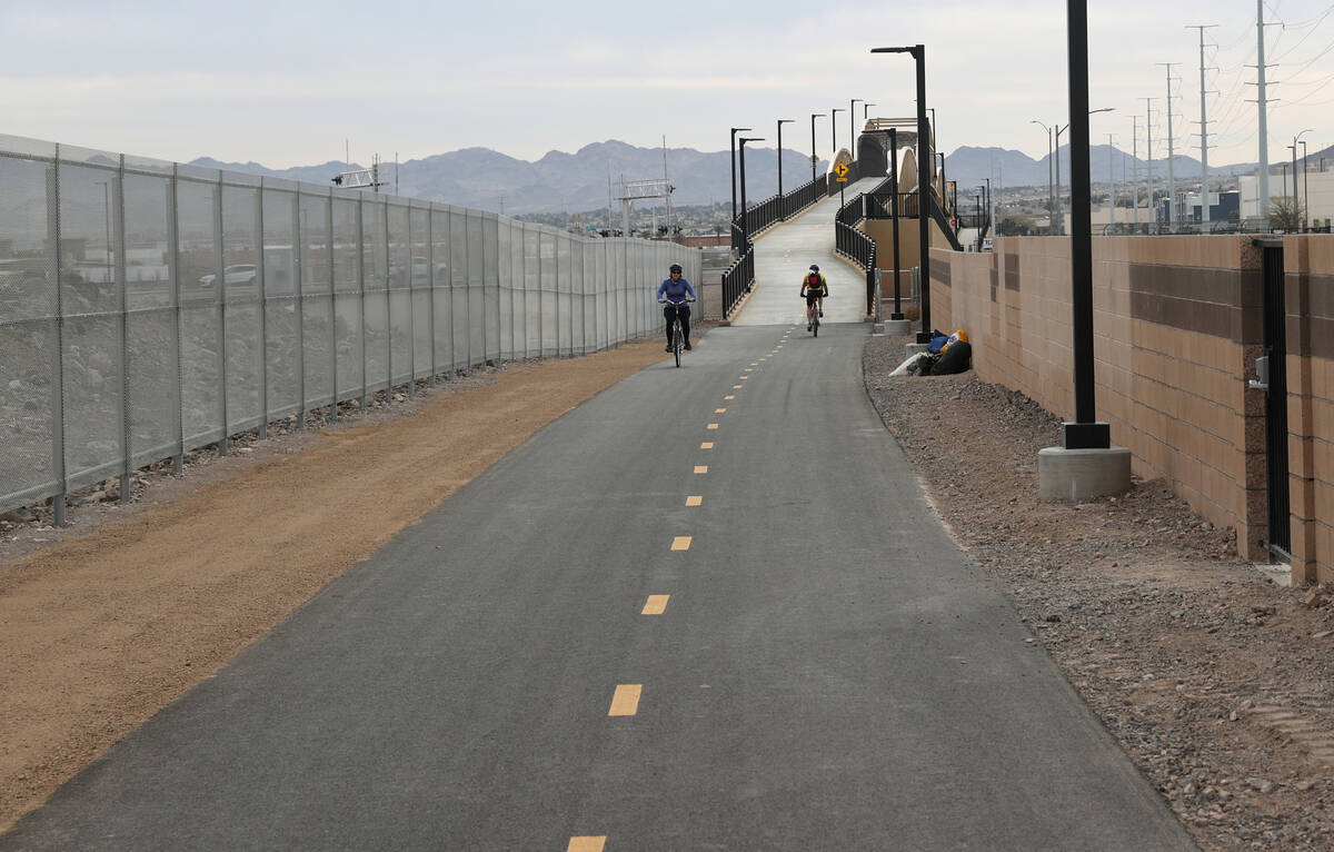 Cyclists ride their bikes during the opening of The Harry Reid Union Pacific Railroad Trail exp ...