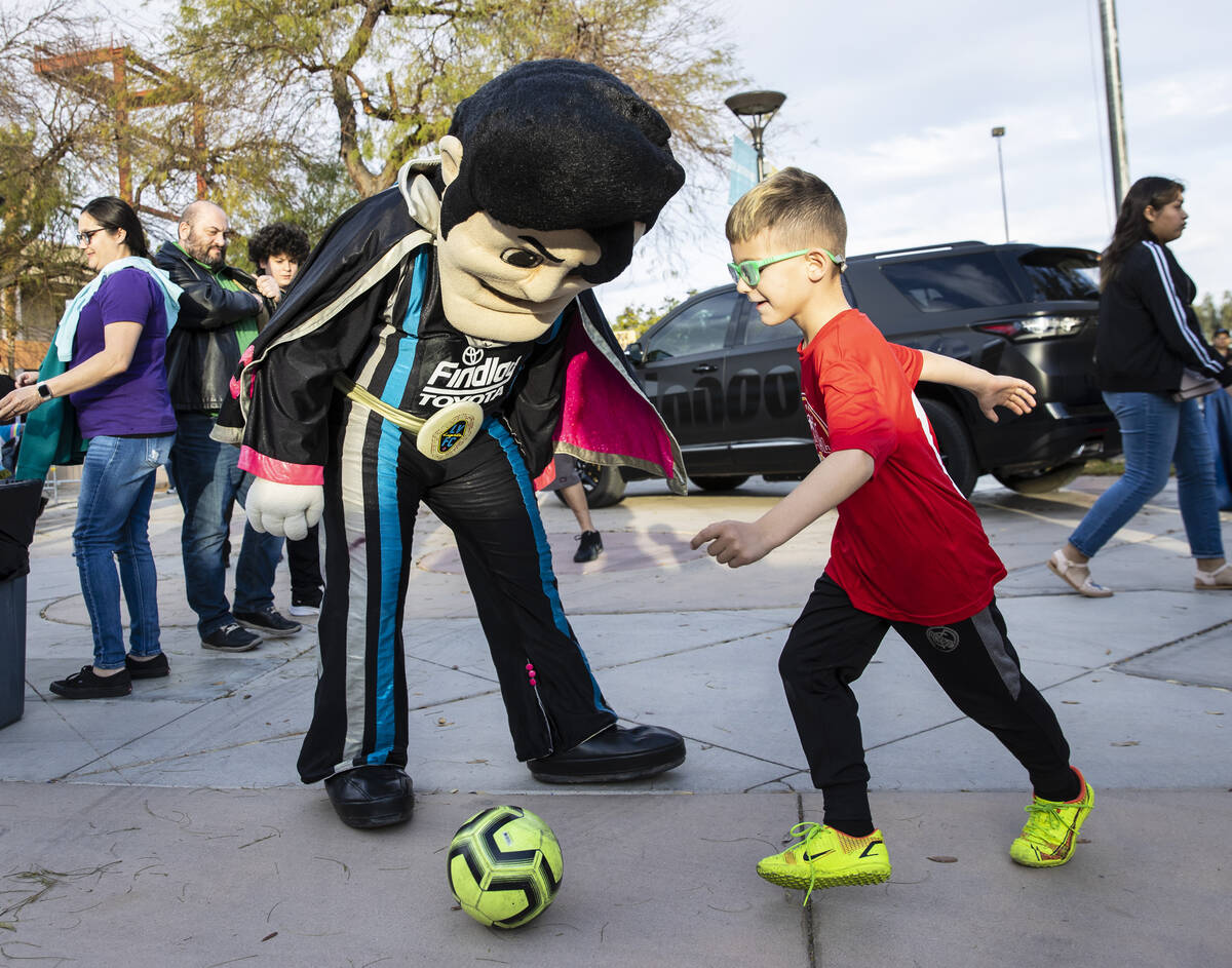 Emil Maslesa, 6, plays Soccer with the Las Vegas Lights FC mascot “Cash the Soccer Rocke ...
