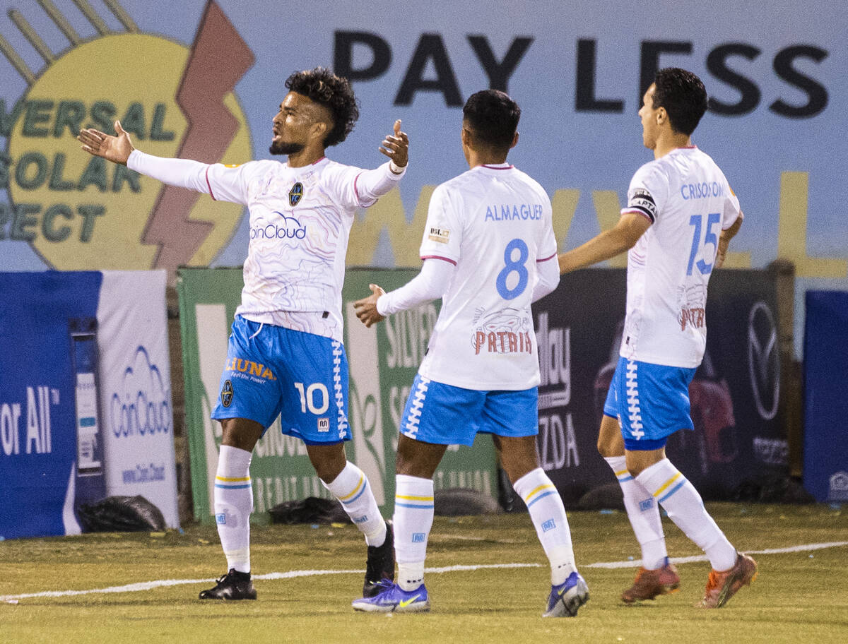 Las Vegas Lights’ forward Daniel Trejo (10) celebrates his goal with teammates Jorge Alm ...