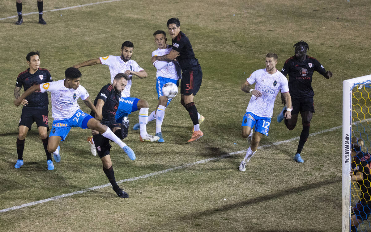 Las Vegas Lights’ Frank Daroma (20) kicks the ball toward Phoenix Rising’s goal d ...