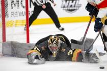 Golden Knights goaltender Logan Thompson (36) dives to save a shot on goal by Panthers left win ...
