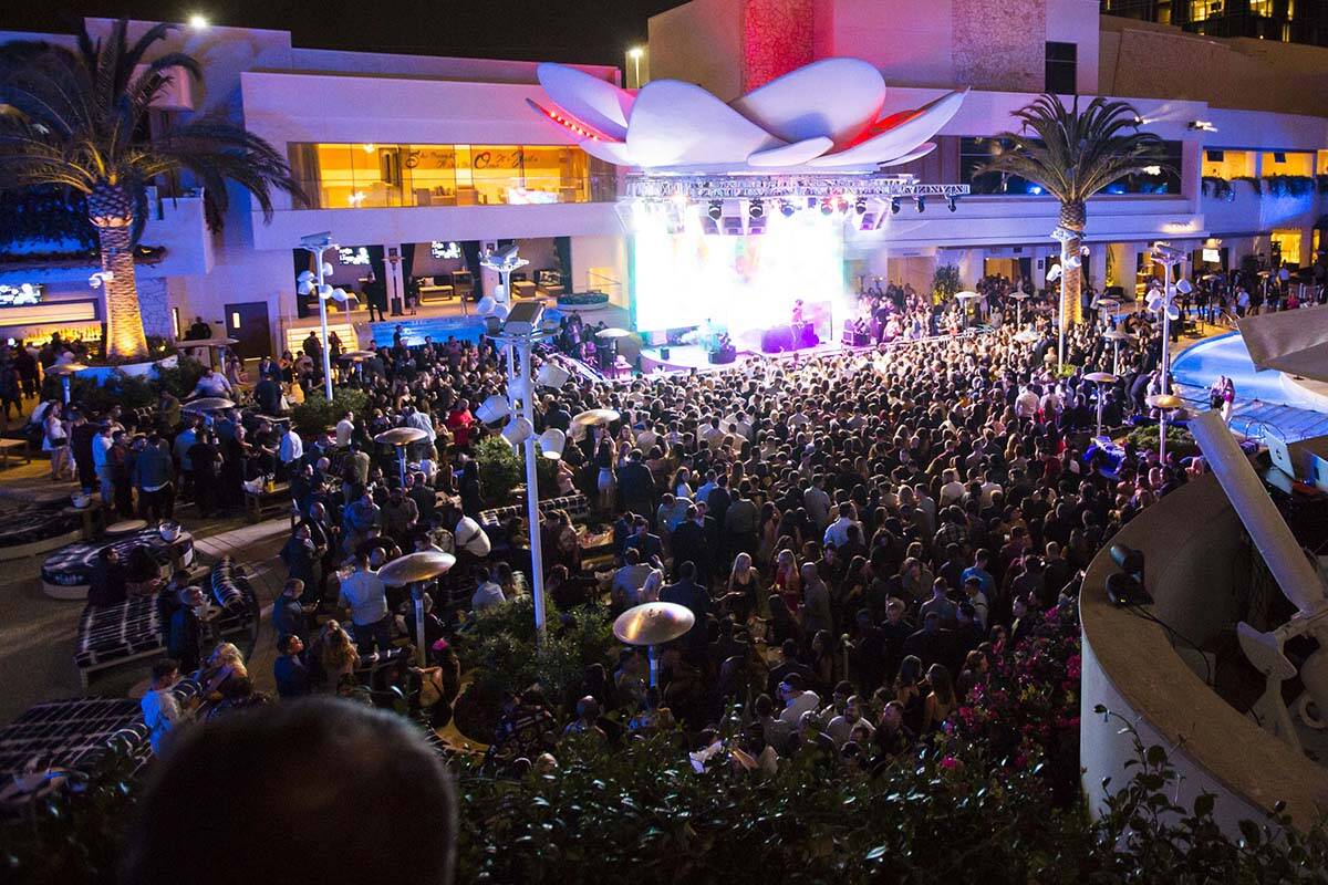 Attendees dance to Saint Jhn around the outdoor area the during the grand opening weekend of Ka ...