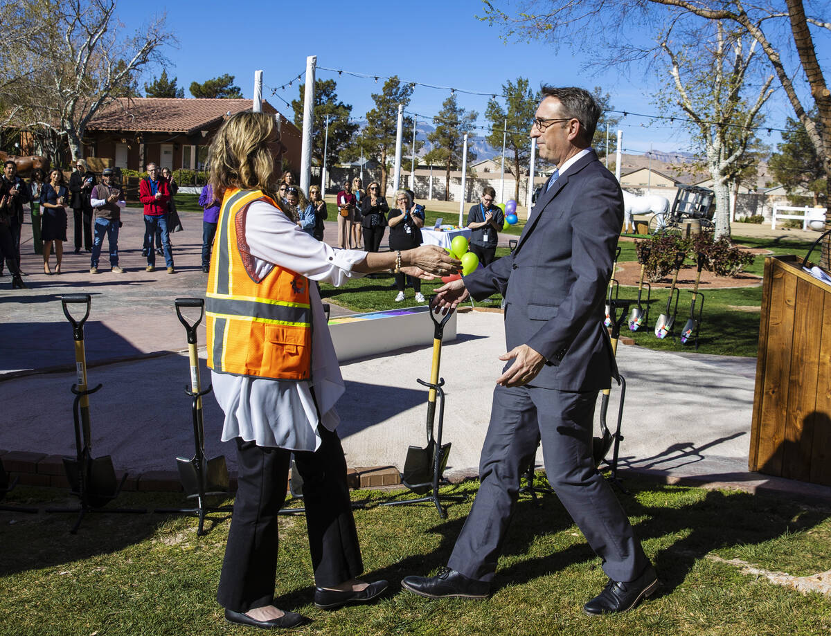 Lynda Tache, left, executive director of Collaboration Center Foundation, greets State Sen. Sco ...