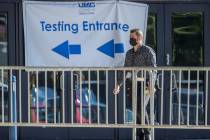 A man enters the free walk-up COVID-19 testing offered at Cashman Center in partnership with Un ...
