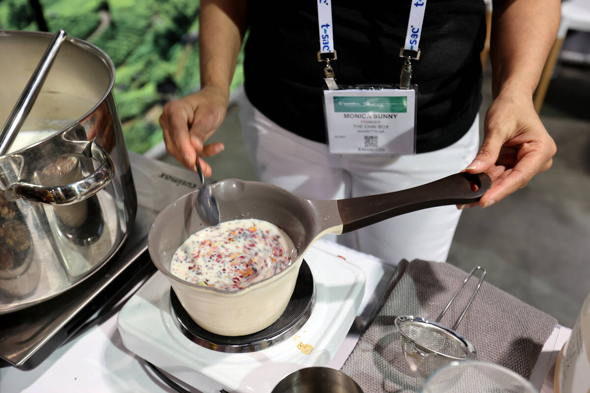 Monica Sunny, founder of The Chai Box, makes tea during the World Tea Conference + Expo at the ...
