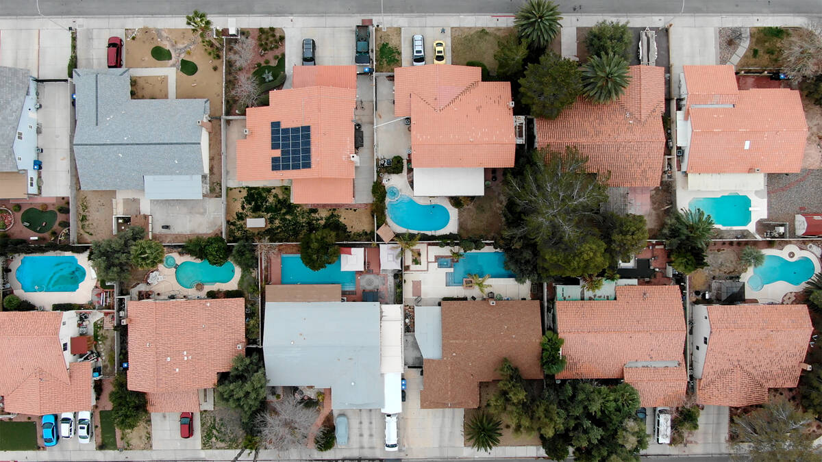 This Feb. 16, 2019, file photo shows aerial view of homes with swimming pools near Navarre Lane ...