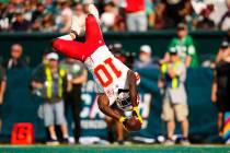 FILE - Kansas City Chiefs wide receiver Tyreek Hill (10) celebrates in the end zone after scori ...