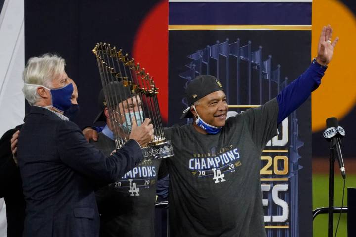 In this Oct. 27, 2020, file photo, Los Angeles Dodgers manage Dave Roberts celebrates with the ...