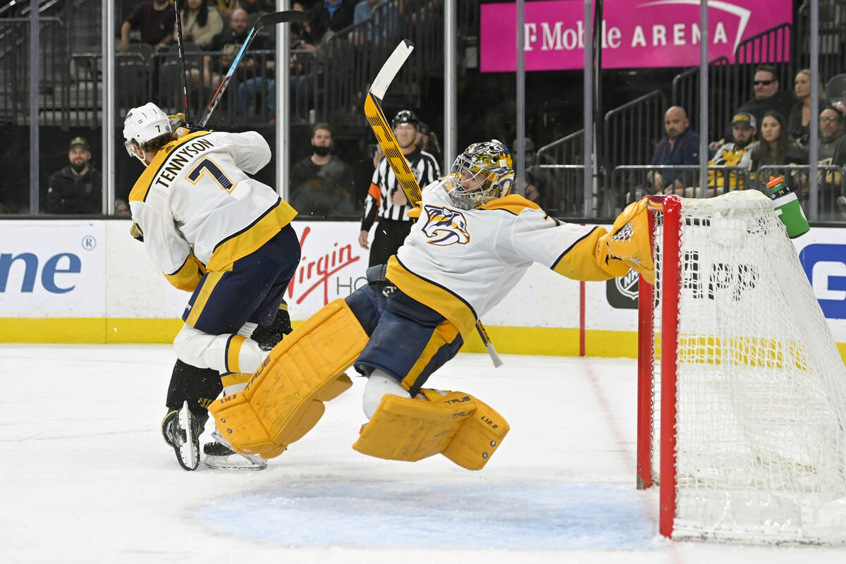 Nashville Predators goaltender Juuse Saros (74) falls after slipping on the ice during the seco ...