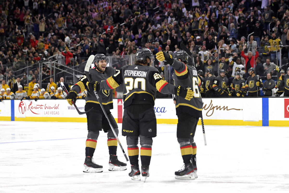 Vegas Golden Knights defenseman Shea Theodore (27), center Chandler Stephenson (20) and right w ...