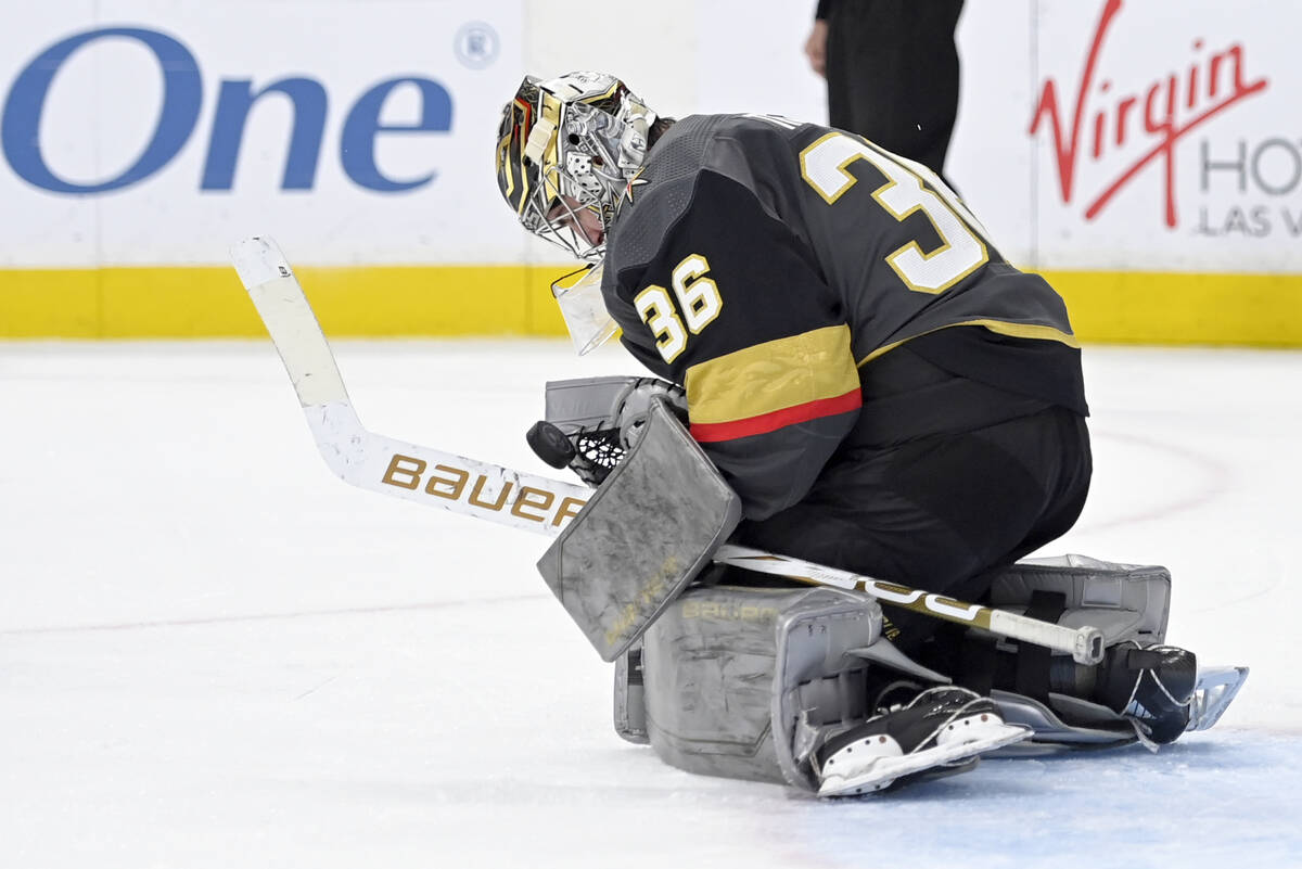 Vegas Golden Knights goaltender Logan Thompson makes a save against the Nashville Predators dur ...