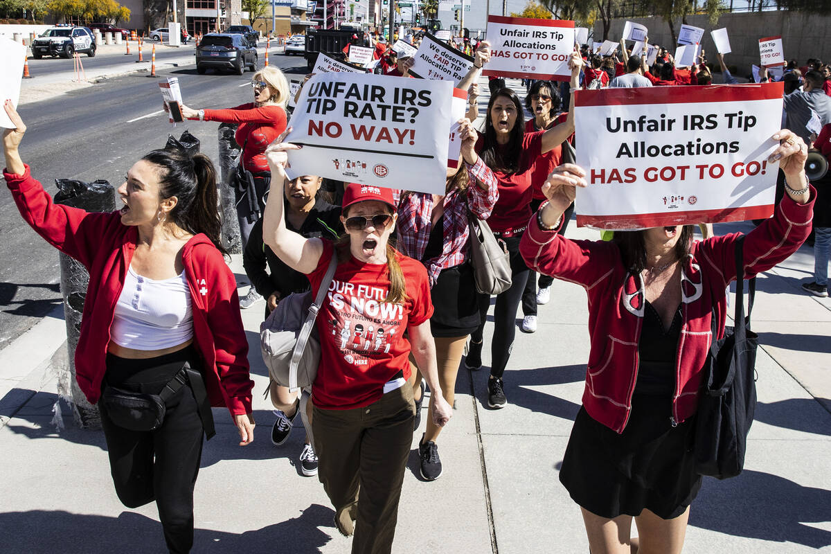 Hundreds of culinary and bartenders union members rally outside of the Foley Federal Building i ...