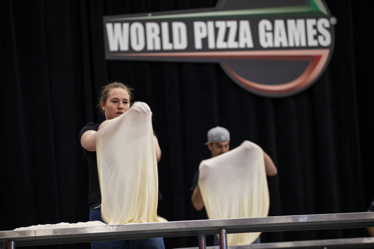 Allison Leroux, of Ontario, Canada, competes in the largest dough stretch event during the Inte ...