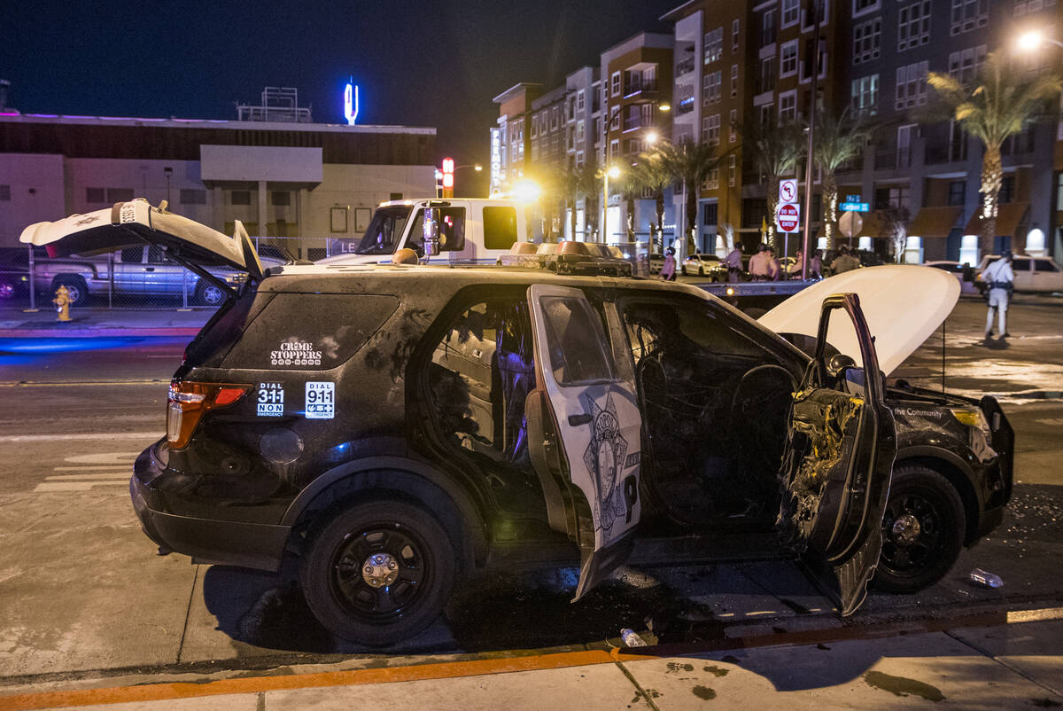 A Las Vegas Police vehicle was set afire on E. Carson Ave at Ninth Street following conflicts d ...