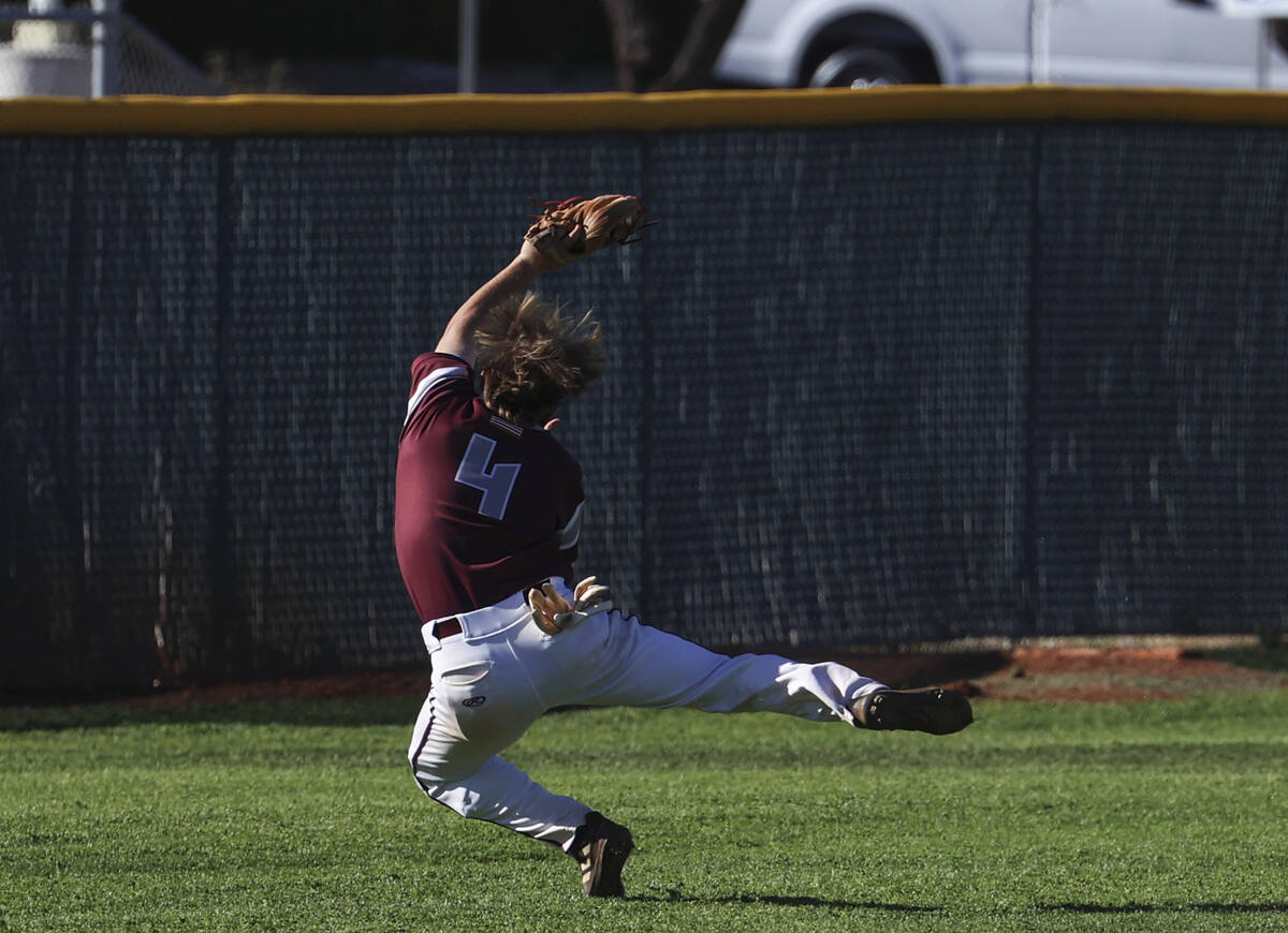 Cimarron-Memorial's Jayrn McLaughlin (4) catches a fly ball from Bishop Gorman during a basebal ...