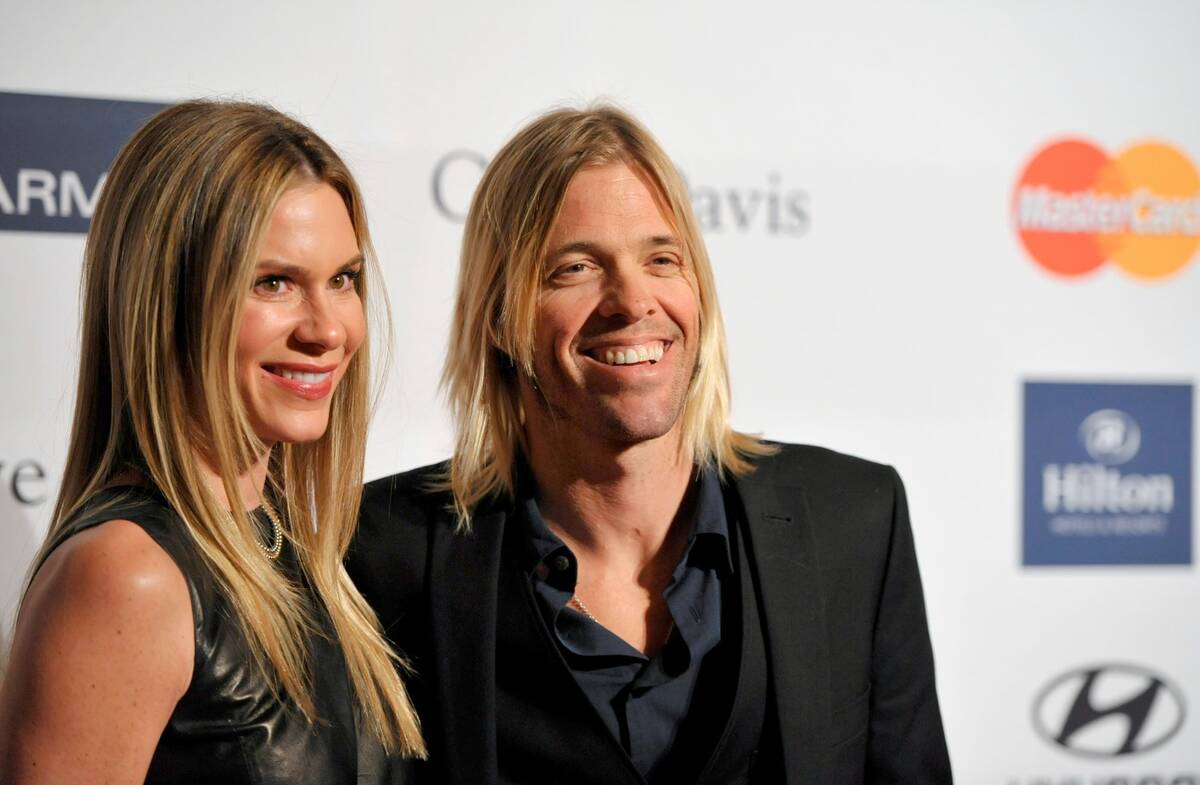 Foo Fighters drummer Taylor Hawkins, right, and Alison Hawkins arrive at the Clive Davis Pre-GR ...