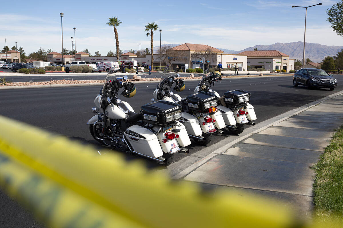 Las Vegas police attend to the scene where a motorcyclist died in a crash at the intersection o ...