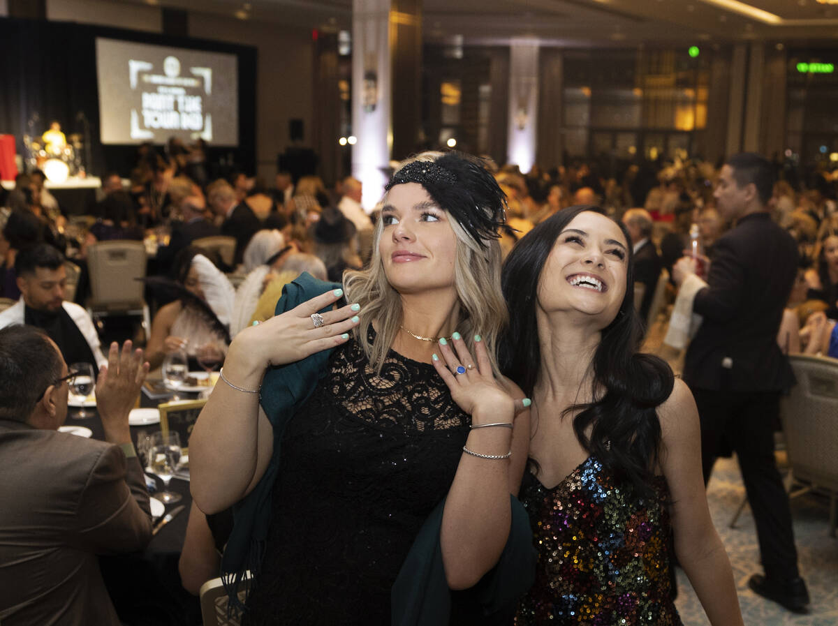 Elizebeth Tucker, left, and Ashley Wong take in the 19th annual Junior League of Las Vegas “P ...