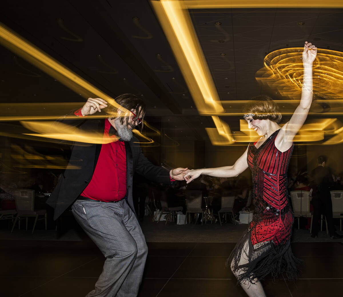 Nick Peterson, left, and Karen Vizzard dance during the 19th annual Junior League of Las Vegas ...