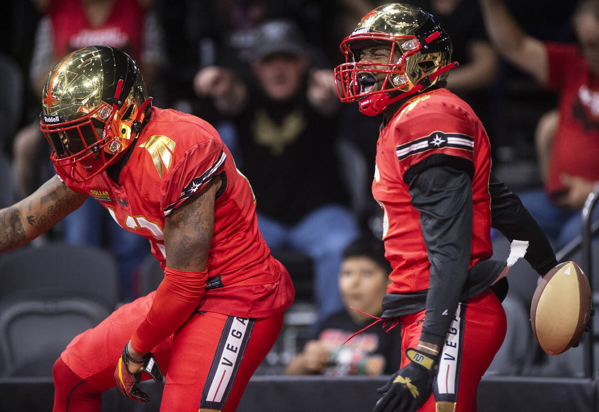 Vegas Knight Hawks wide receiver K.D. Cannon (6) celebrates a touchdown catch with teammate Fra ...