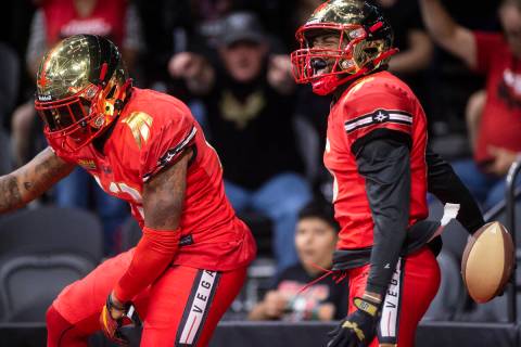 Vegas Knight Hawks wide receiver K.D. Cannon (6) celebrates a touchdown catch with teammate Fra ...