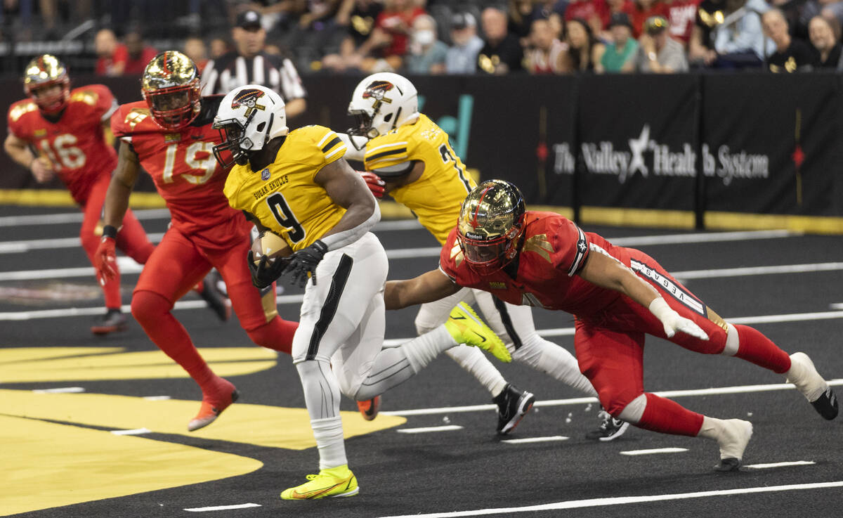 Vegas Knight Hawks defensive lineman Meffy Koloamatangi (11) dives to try and tackle Tucson Sug ...