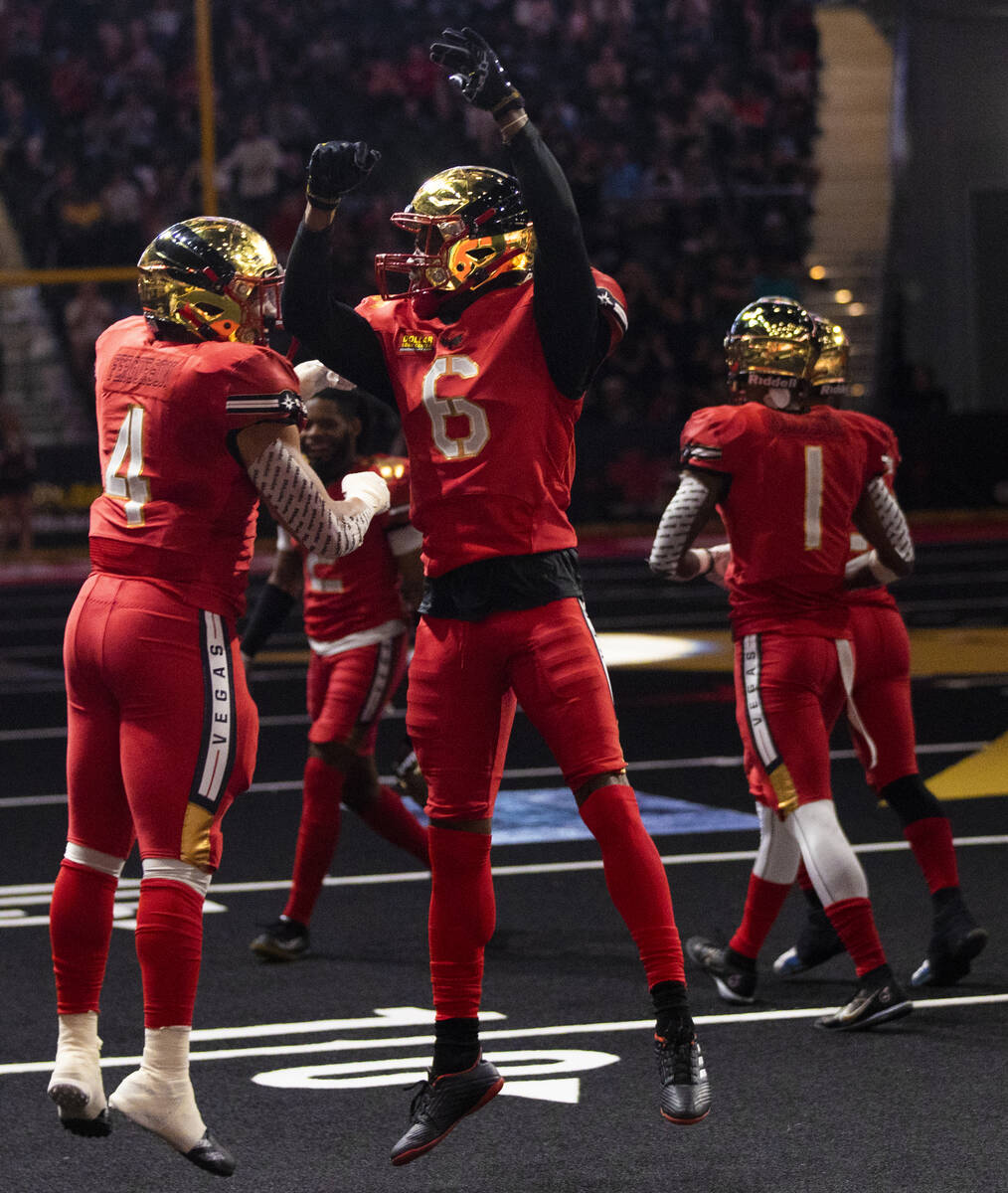Vegas Knight Hawks wide receiver K.D. Cannon (6) celebrates a touchdown catch with teammate Jav ...