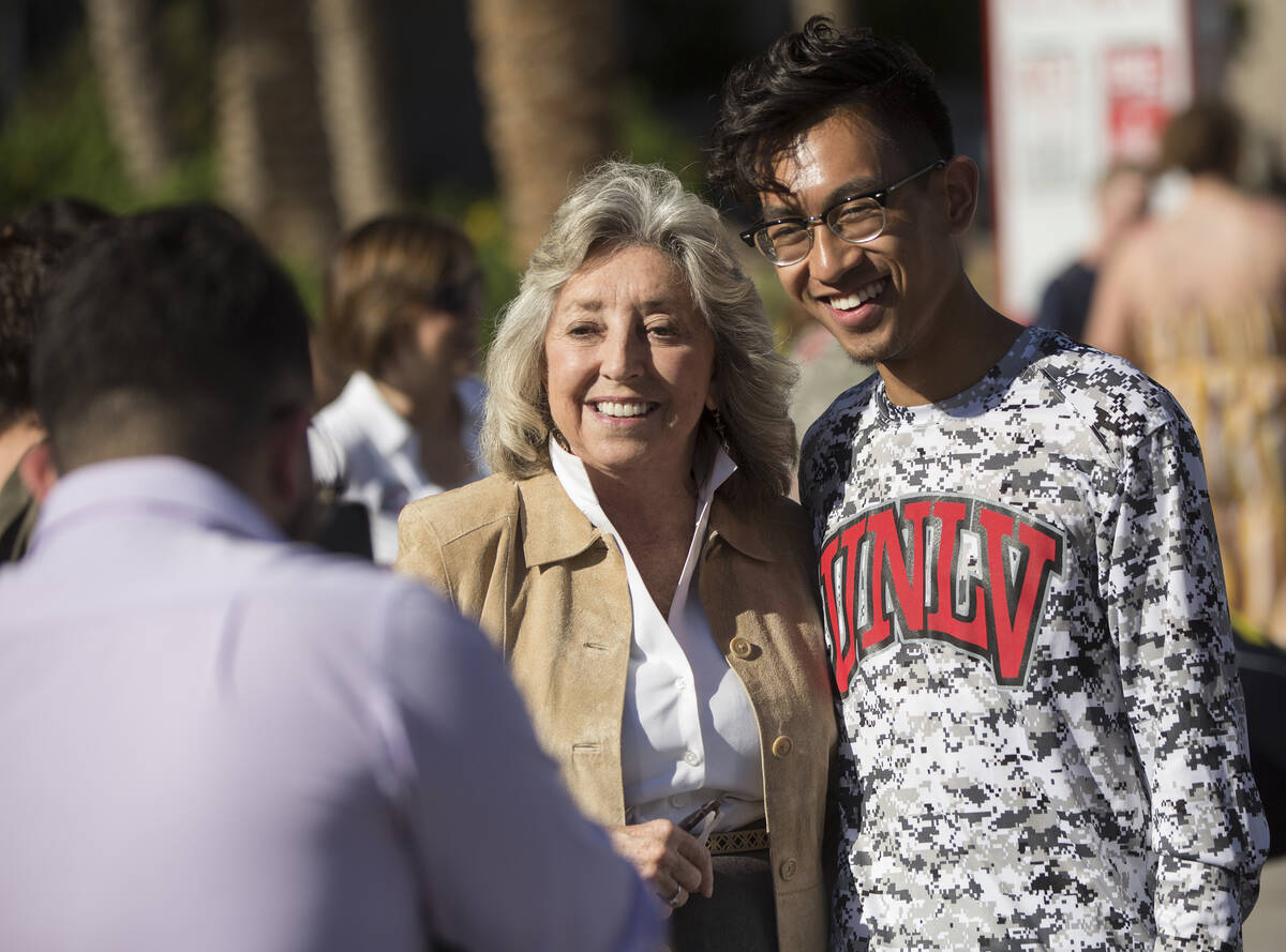 Democratic Congresswoman Dina Titus, left, takes a photo with Karl Catarata during a rally host ...