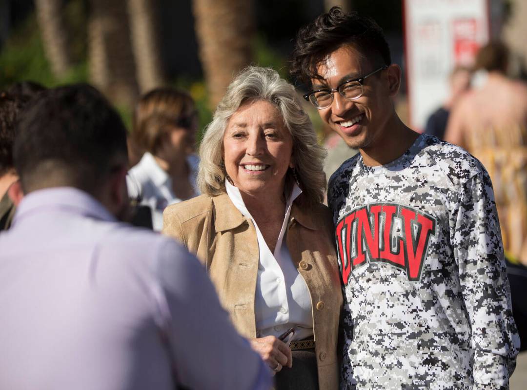 Democratic Congresswoman Dina Titus, left, takes a photo with Karl Catarata during a rally host ...
