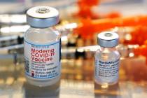 Vials for the Moderna and Pfizer COVID-19 vaccines are seen at a temporary clinic in Exeter, N. ...