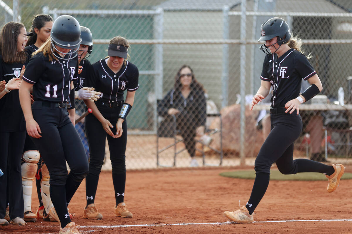 Faith Lutheran’s Savannah Moore (15) runs home after a two-run-homer against Green Valle ...