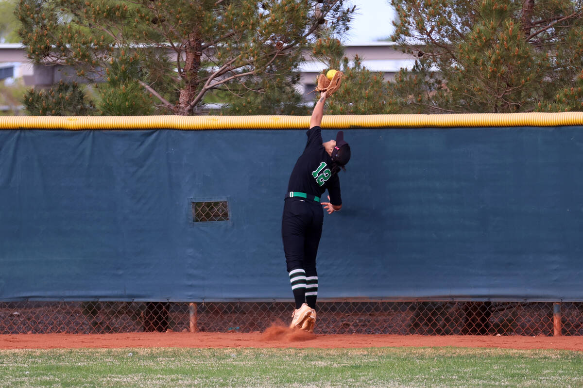 Green Valley’s Hannah Watson (12) misses a catch in the outfield for two-run-homer by Fa ...