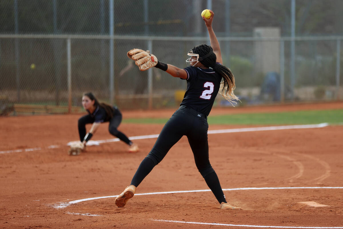 Faith Lutheran’s Ava Walker (2) pitches the ball against Green Valley during a softball ...