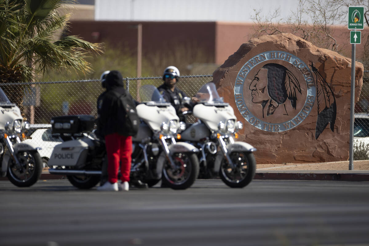 Police investigate a shooting at Western High School in Las Vegas, Tuesday, March 29, 2022. (Er ...