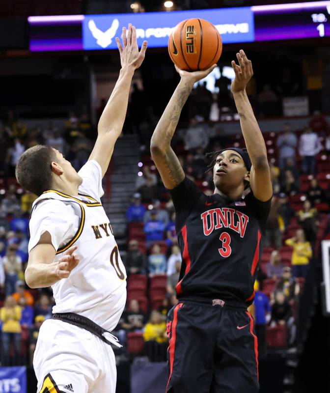 UNLV Rebels forward Donovan Williams (3) shoots over Wyoming Cowboys guard Drake Jeffries (0) d ...