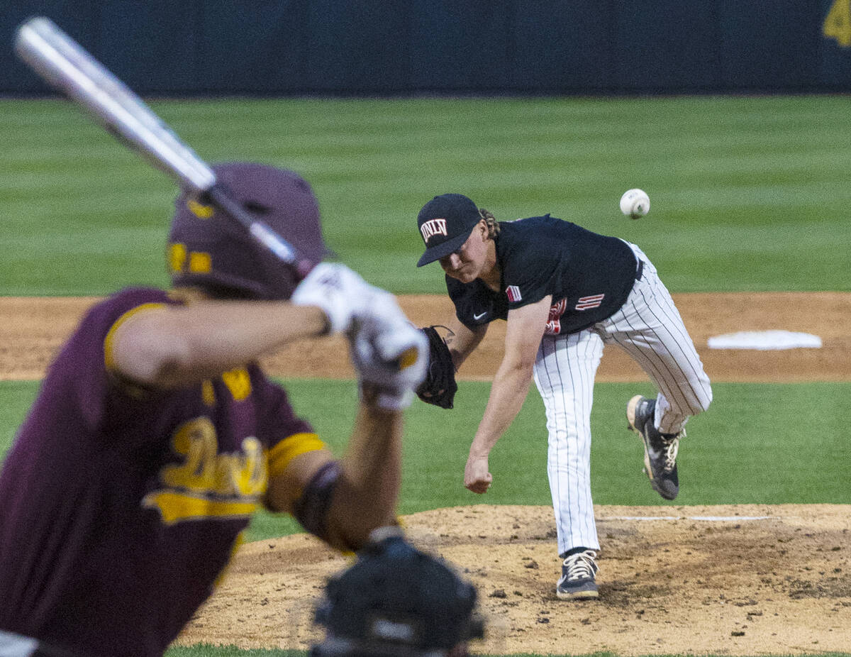 UNLV pitcher Josh Sharman (11) delivers against Arizona St. outfielder Ivan Brethowr (28) durin ...