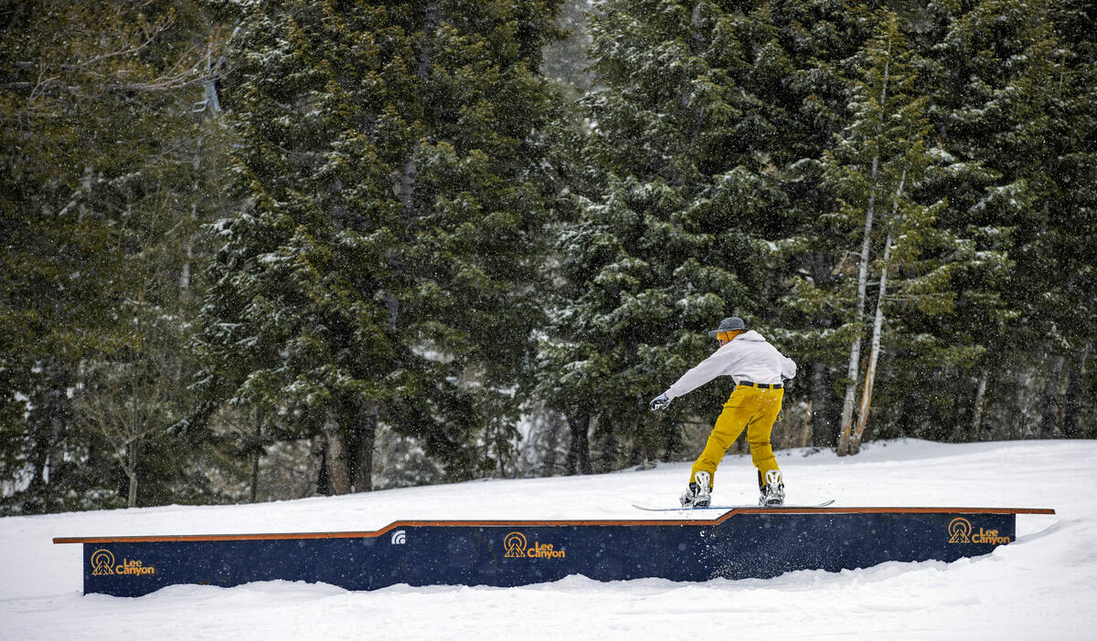 Jackson Fogarty of Henderson snowboards along a rail at Lee Canyon on the final week of the ski ...