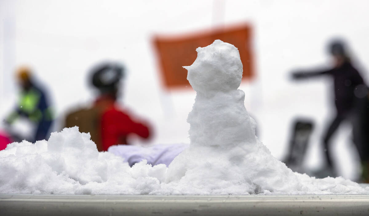 A snowman slowly melts at the ski lodge at Lee Canyon on the final week of the ski season on Tu ...