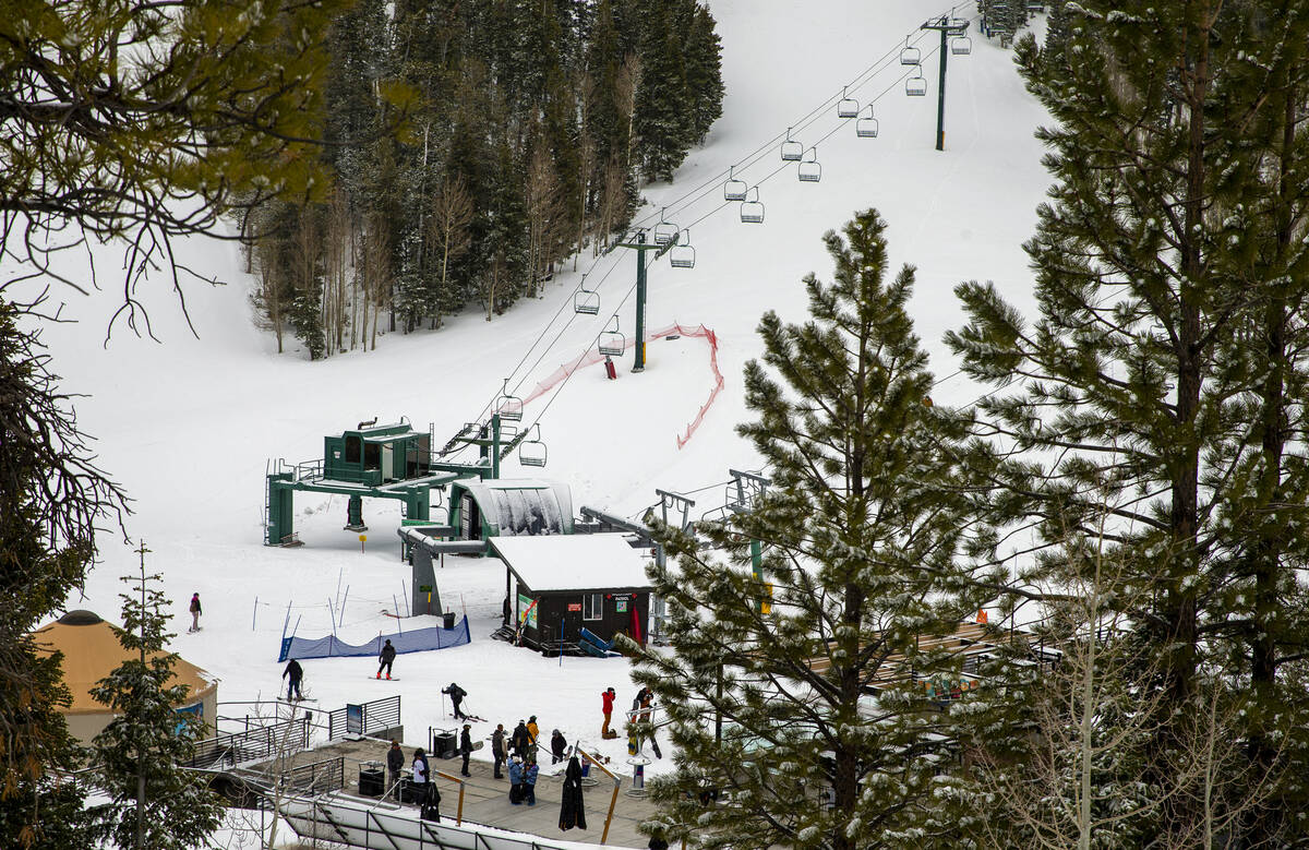Skiers and snowboarders take to the several new inches of recently fallen snow at Lee Canyon on ...