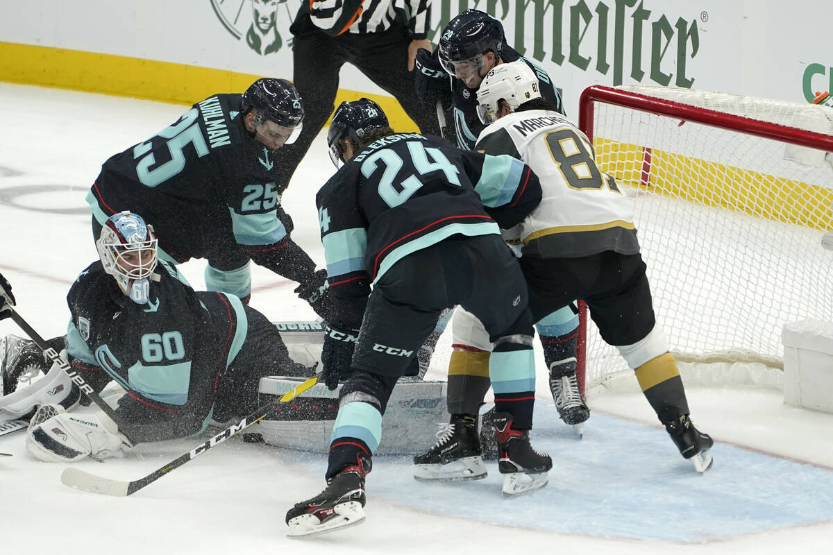 Seattle Kraken goaltender Chris Driedger (60) stops a shot with his leg pad during the second p ...